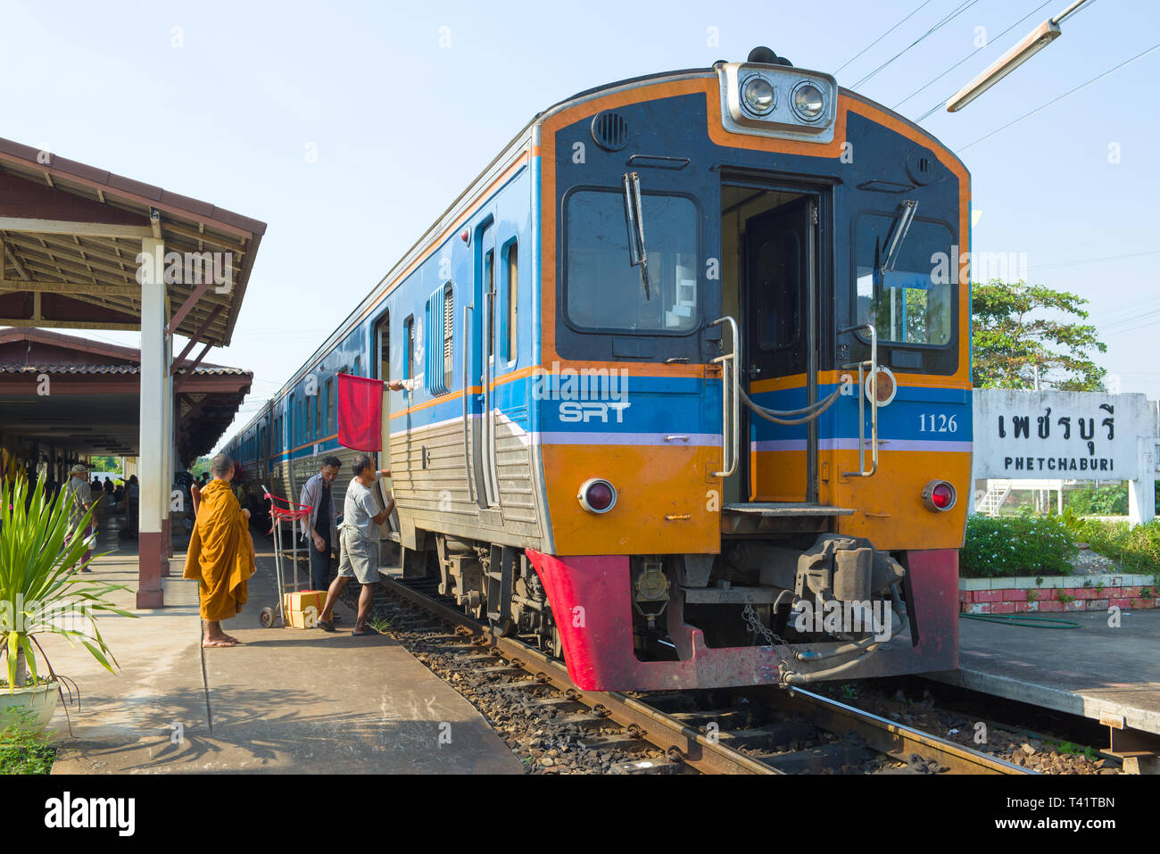 PHETCHABURI, THAILAND - DECEMBER 13, 2018: Boarding a passenger train on the station of Phetchaburi Stock Photo