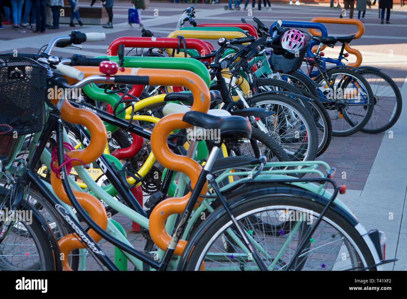 Bicycles parked in a rack in front of the Manufaktura Shopping Centre. Lodz, Poland. Stock Photo