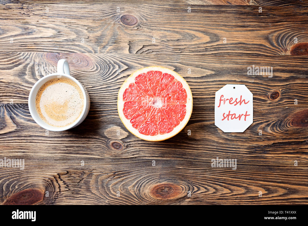 Cheerful start. Coffee, grapefruit, reminder. Concept, top view Stock Photo
