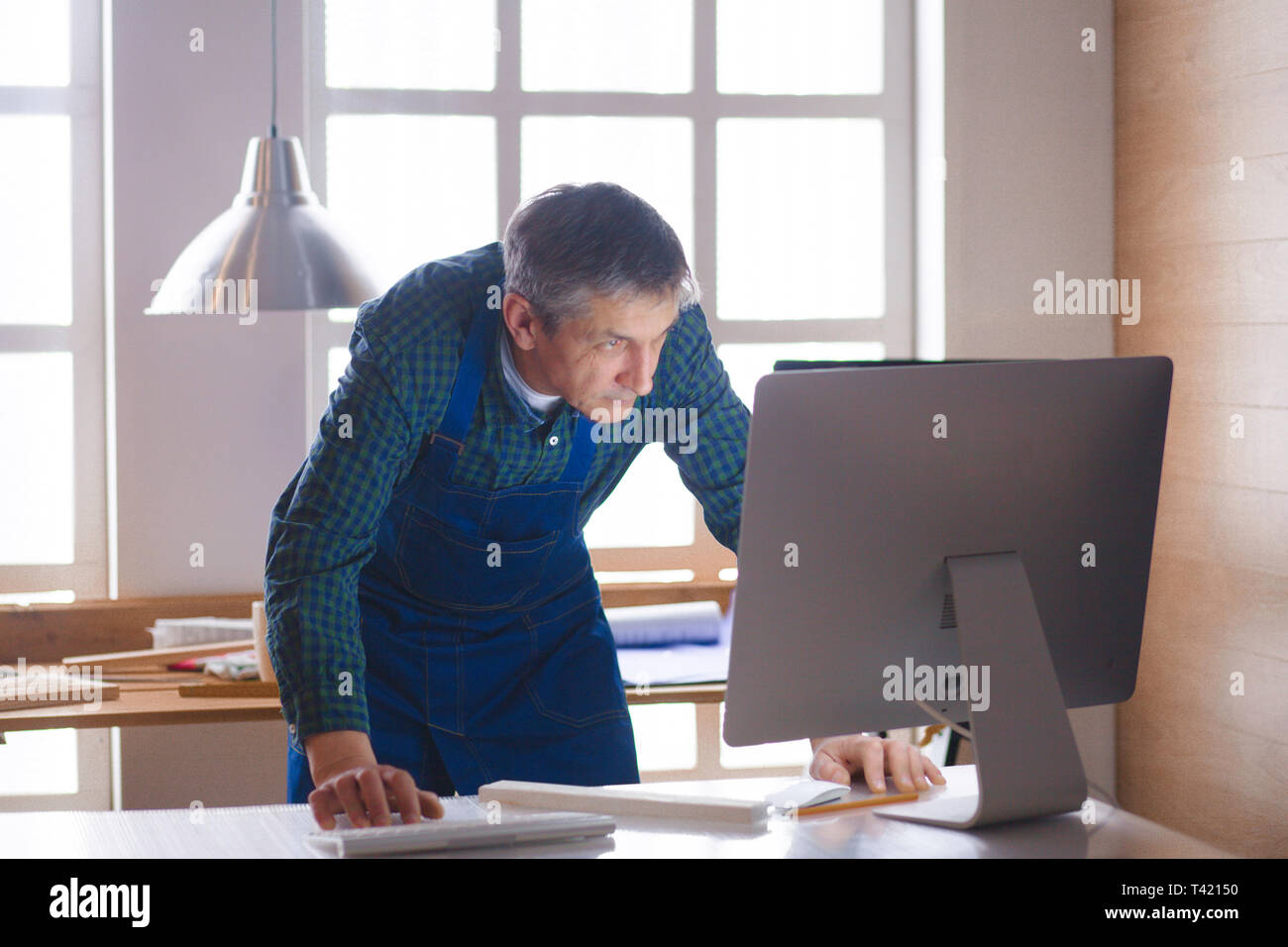 Craftsman artisan working laptop hi-res stock photography and images ...