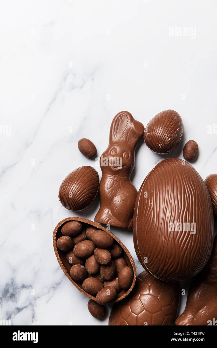 Chocolate easter eggs and bunnies on a marble background Stock Photo