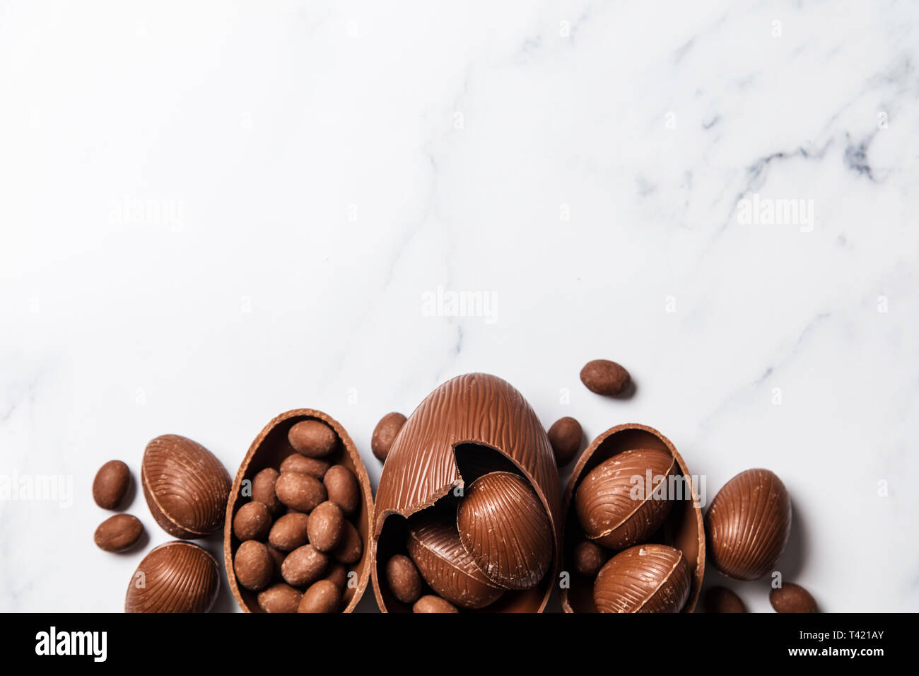 Chocolate easter eggs and bunnies on a marble background Stock Photo