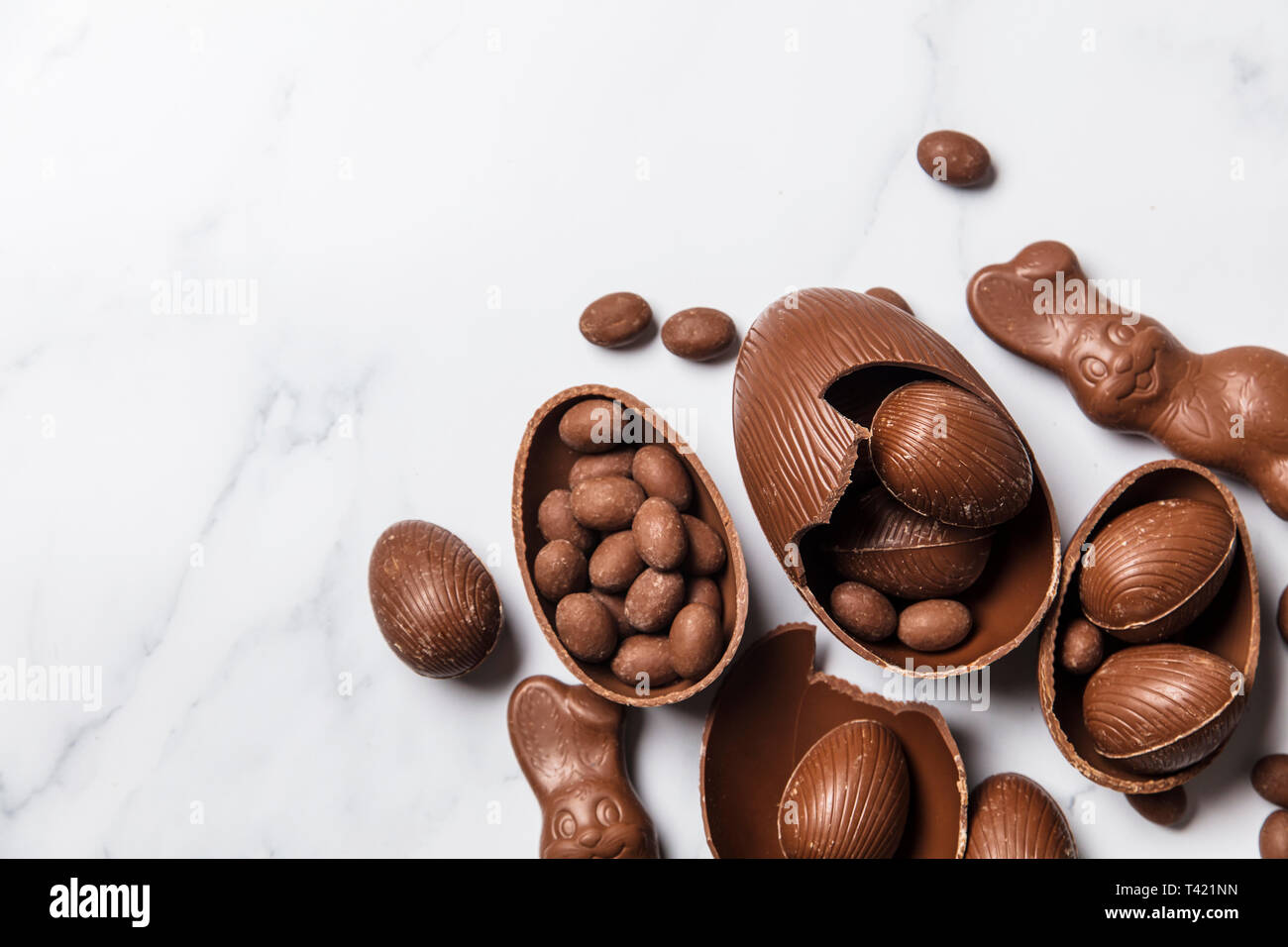 Chocolate easter eggs and bunnies on a marble background Stock Photo