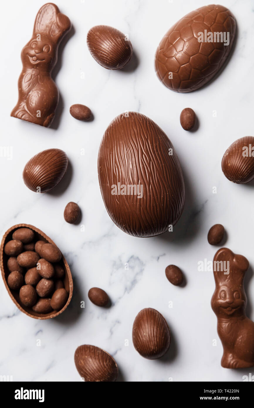 Chocolate easter eggs and bunnies on a marble background Stock Photo