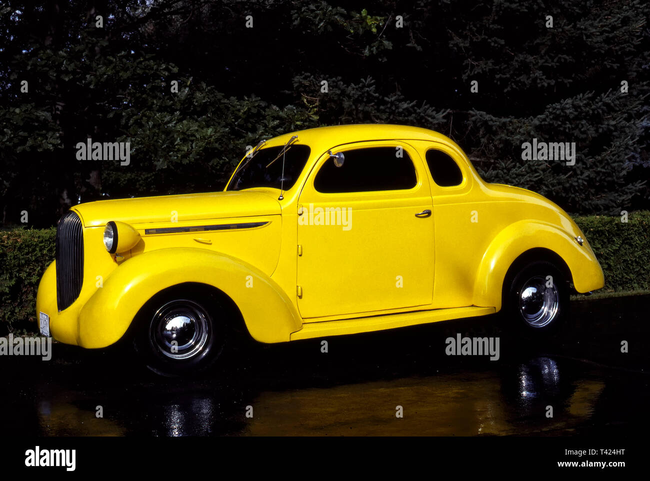1938 Plymouth Hotrod on wet pavement Stock Photo