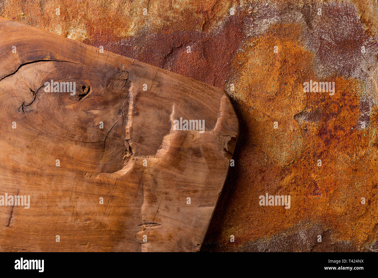 Vintage cutting board on rusty metal background, view from above Stock Photo