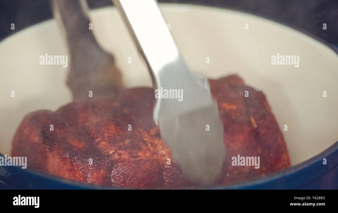 Step by step. Cooking boneless pork roast in cast iron dutch oven Stock
