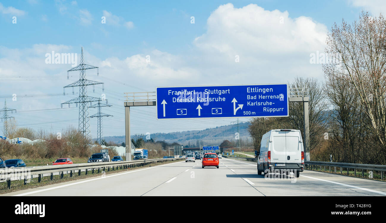 Stuttgart, Germany - Mar 26, 2016: POV Driving fast on German autobahn  highway withcars vans on perfect road condition and multiple Frankfurt,  Dreieck, Karlsruhe, Ettlingen, arrow, sign direction Stock Photo - Alamy