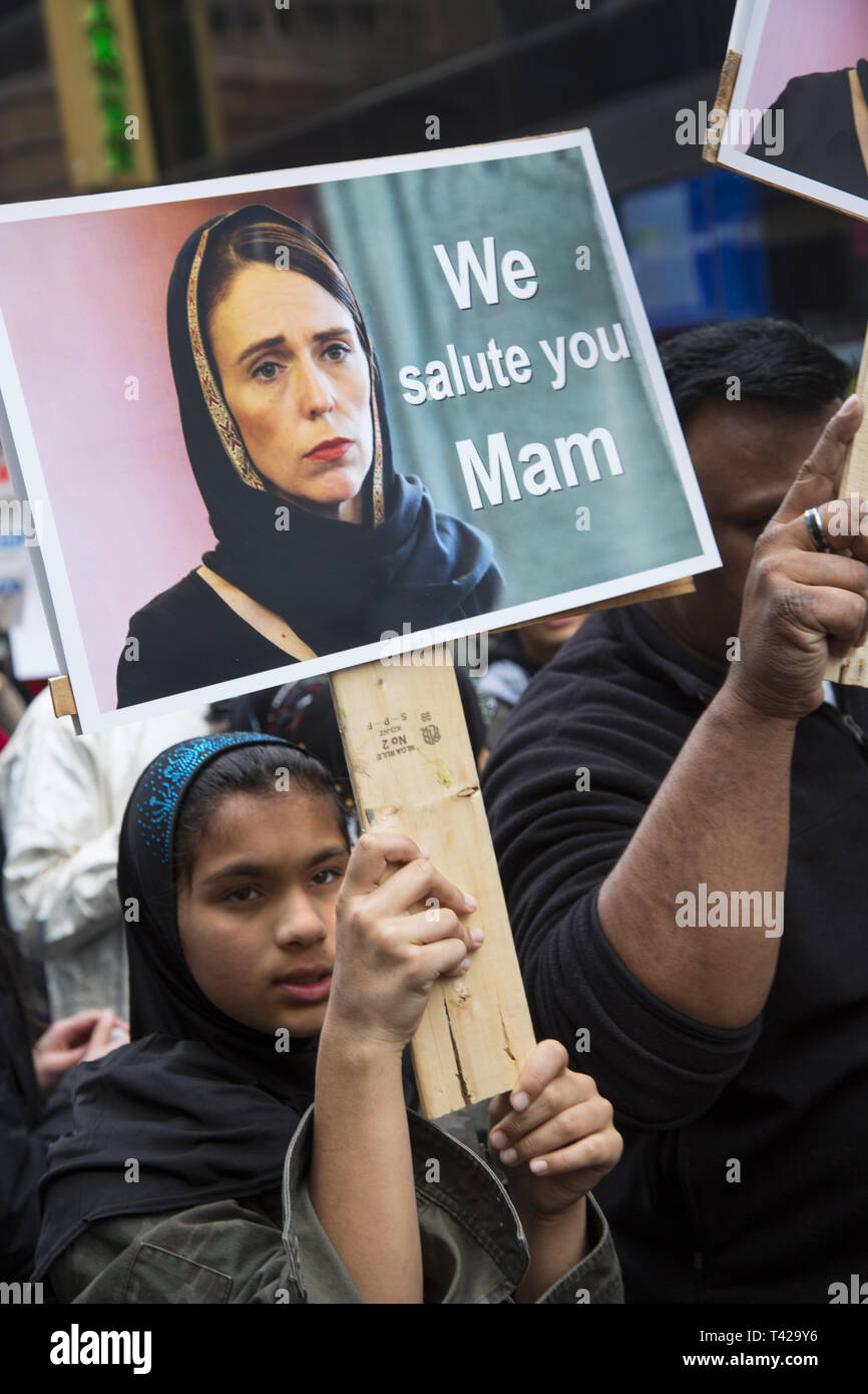 Young Palestinian woman carries a photo of Prime Minister Jacinda Ardern of New Zealand that thanks her for her compassionate response to the mass shooting of Muslims and her fast action to ban automatic assault weapons immediately. Muslims rally and march in New York CIty after the New Zealand massacre and for the Palestinians in Gaza as well as against Islamophobia in general. Stock Photo