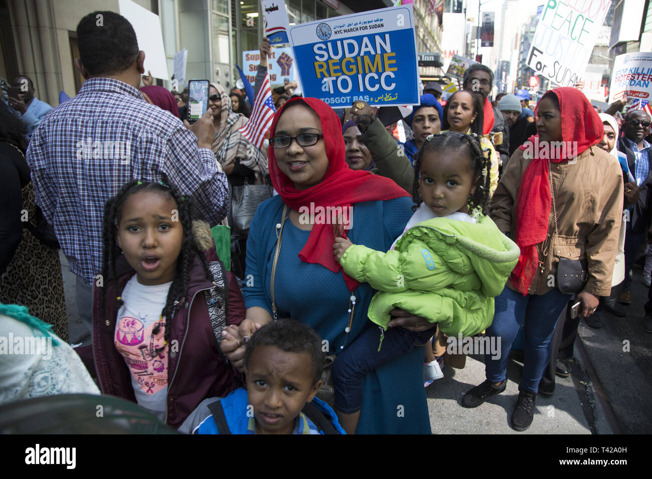 4/6/19: Days before Sudan's dictatorial president Omar al-Bashir was forced from office by a military coup, Sudanese Americans and immigrants demonstrate and march to the UN in NY City to have Bashir resign immediately from office and have democracy restored i9n Sudan. Stock Photo