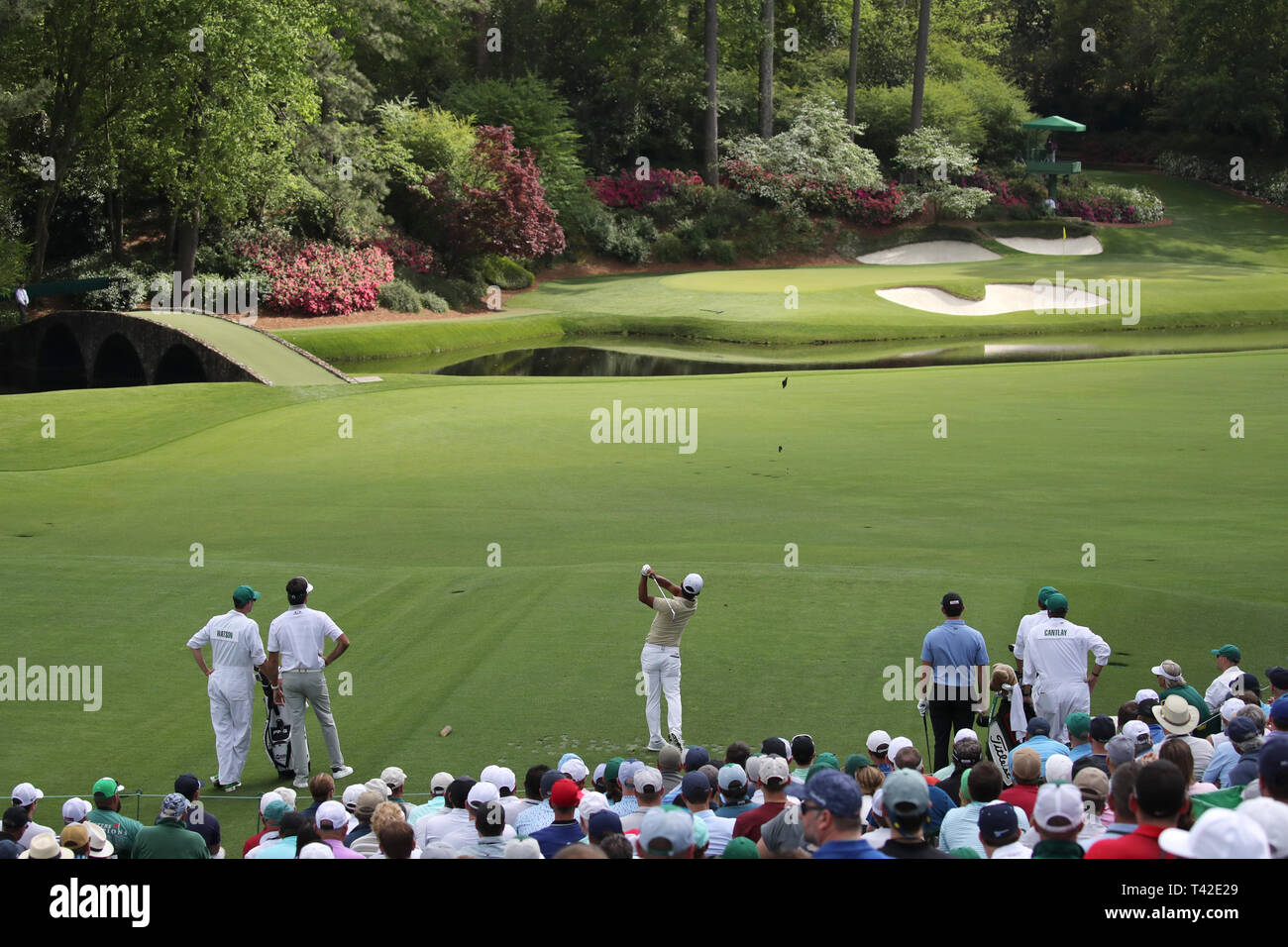Japans Satoshi Kodaira hits his tee shot on the 12th hole during the first round of the 2019 Masters golf tournament at the Augusta National Golf Club in Augusta, Georgia, United States
