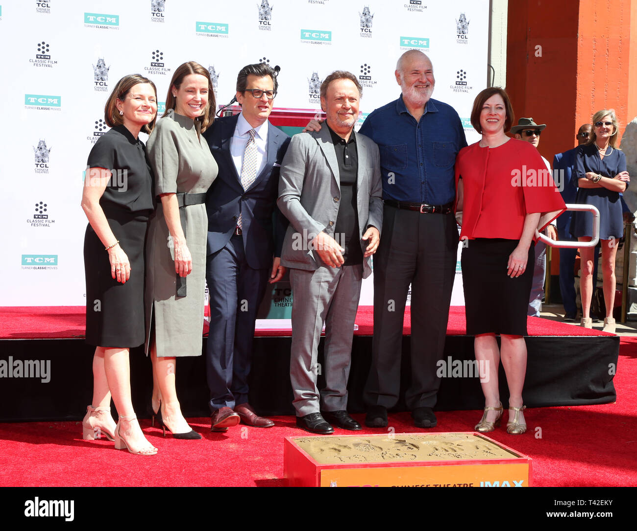 Hollywood, Ca. 12th Apr, 2019. Billy Crystal, Ben Mankiewicz, Rob Reiner, Jennifer Dorian, Charles Tabesh, Genevieve McGillicuddy, at 2019 10th Annual TCM Classic Film Festival - Hand and Footprint Ceremony: Billy Crystal at the TCL Chinese Theatre IMAX on April 12, 2019. Credit: Faye Sadou/Media Punch/Alamy Live News Stock Photo