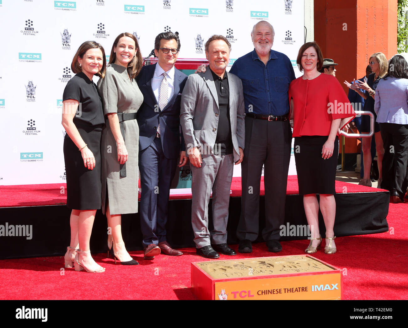 Hollywood, Ca. 12th Apr, 2019. Billy Crystal, Ben Mankiewicz, Rob Reiner, Jennifer Dorian, Charles Tabesh, Genevieve McGillicuddy, at 2019 10th Annual TCM Classic Film Festival - Hand and Footprint Ceremony: Billy Crystal at the TCL Chinese Theatre IMAX on April 12, 2019. Credit: Faye Sadou/Media Punch/Alamy Live News Stock Photo