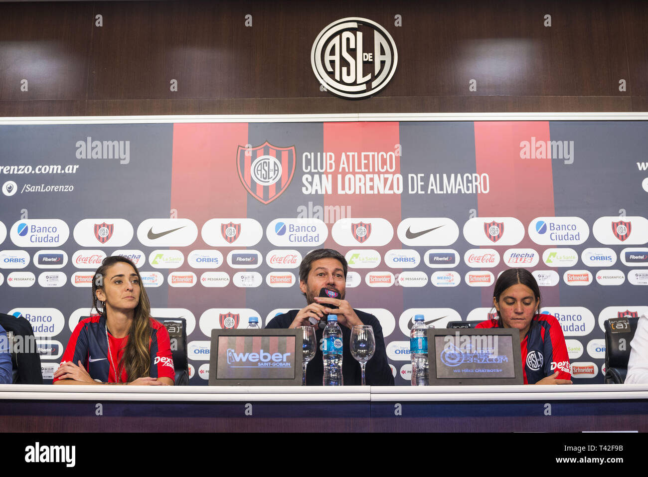 April 12, 2019 - City Of Buenos Aires, City of Buenos Aires, Argentina - SPORTS WorldNews. 2019 April 12, City of Buenos Aires, Argentina. Athletic Club San Lorenzo de Almagro Female football team sign on 2019 April 12th the first professional female football contract in Argentina on first category, after the Argentinian Football Association (AFA in Spanish) agreed on 2019 March 18 to professionalized female football.MACARENA SANCHEZ, one of the football players who fight the lasts months for Professional Female Football (left), MATIAS LAMMENS, President of Athletic Club San Lorenzo (Center), Stock Photo