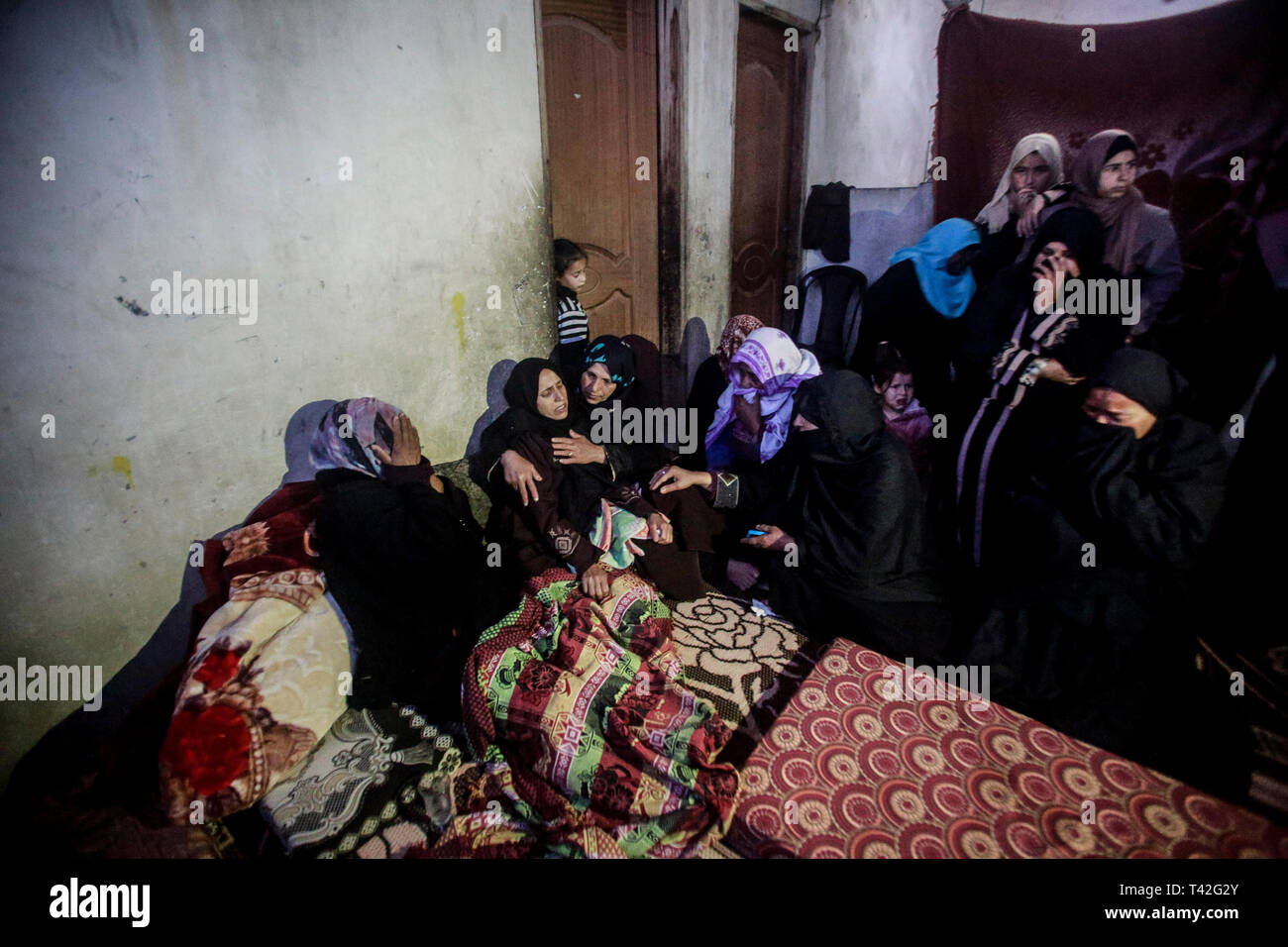 Relatives of the Palestinian martyr Misra Abu Shallouf seen mourning during the farewell. Maysara Abu Shallouf was killed on the border fence between Israel and the Gaza Strip during a protest , in the northern Gaza Strip. Stock Photo