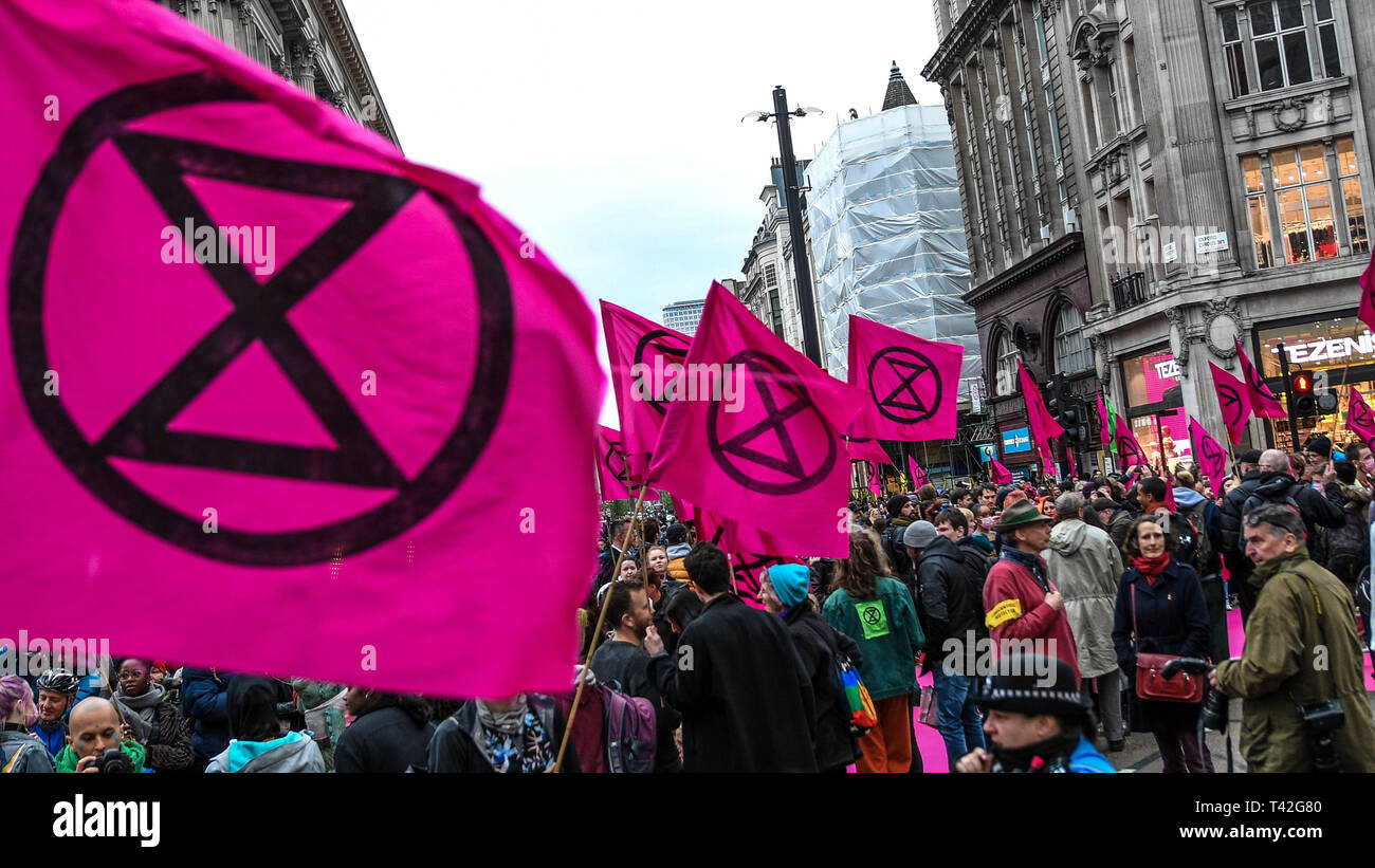 London, UK. 12th Apr, 2019. A general view of the catwalk during the Extinction Rebellion fashion show in London. The Extinction Rebellion Fashion Action group brought Oxford Circus to a standstill by staging a creative and symbolic catwalk titled Fashion: Circus of Excess. The objective is to raise the alarm about the role fashion consumption plays in fuelling the Climate and Ecological emergency. The fashion industry is set to consume a quarter of the world's carbon budget by 2050 in clothing production. Credit: SOPA Images Limited/Alamy Live News Stock Photo