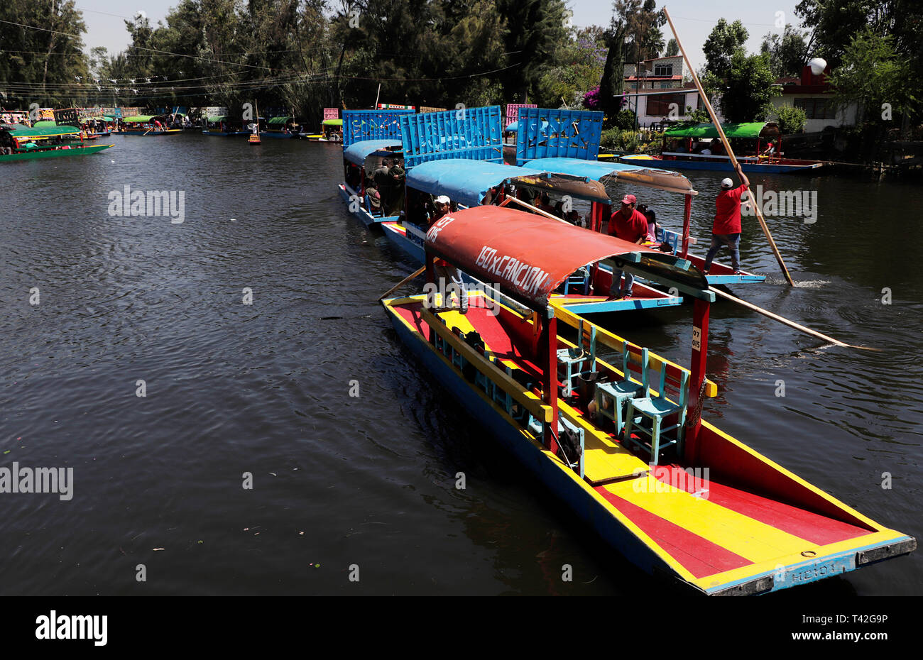 12 April 2019, Mexico, Mexiko-Stadt: Trajinera operate on a canal in Xochimilco. Located on the southern outskirts of the metropolis of millions, the canals on which the colourfully decorated boats sail are a popular excursion destination. Photo: Gerardo Vieyra/dpa Stock Photo