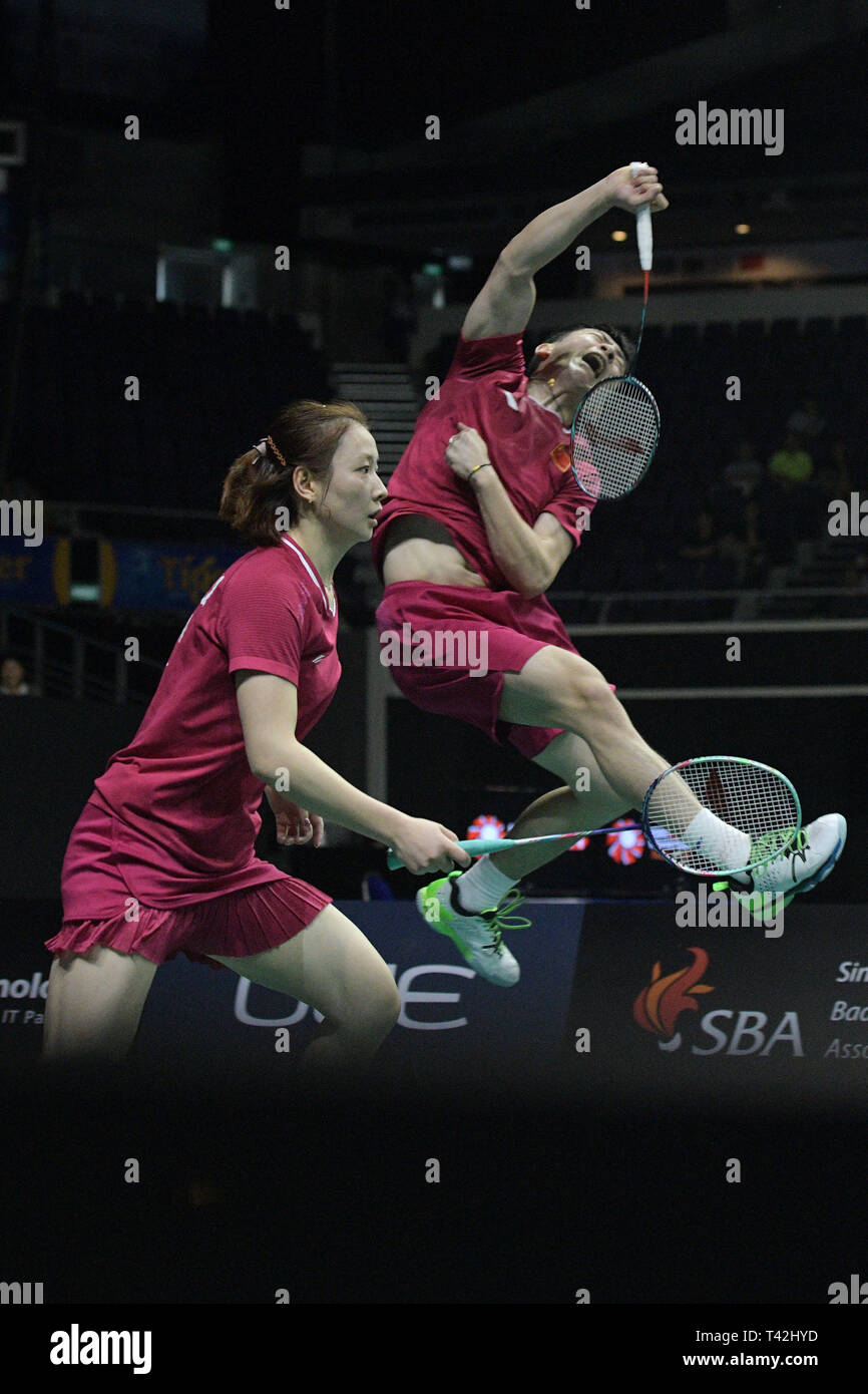 Singapore. 13th Apr, 2019. Zheng Siwei(Top)/Huang Yaqiong of China compete  during the mixed doubles semifinal match against Dechapol  Puavaranukroh/Sapsiree Taerattanachai of Thailand at Singapore Badminton  Open in Singapore on April 13, 2019.