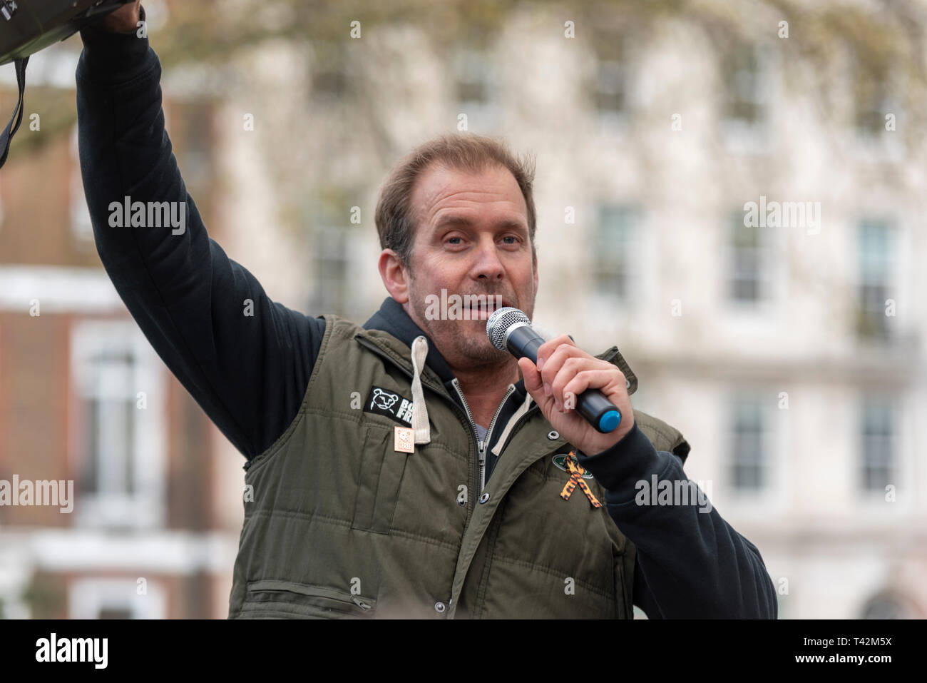 Dan Richardson speaking at a stop trophy hunting and ivory trade protest rally, London, UK. Actor, activist Stock Photo