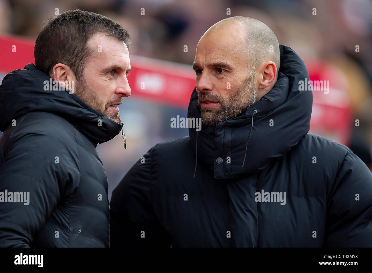 Stoke on Trent , UK. 13th April 2019.      Nathan Jones Manager of Stoke City talking with good friend Paul Warne Manager of Rotherham United during the Sky Bet Championship match between Stoke City and Rotherham United at the Britannia Stadium, Stoke-on-Trent on   Editorial use only, license required for commercial use. No use in betting, games or a single club/league/player publications. Photograph may only be used for newspaper and/or magazine editorial purposes. May not be used for publications involving 1 player, 1 club or 1 compet Credit: MI News & Sport /Alamy Live News Stock Photo