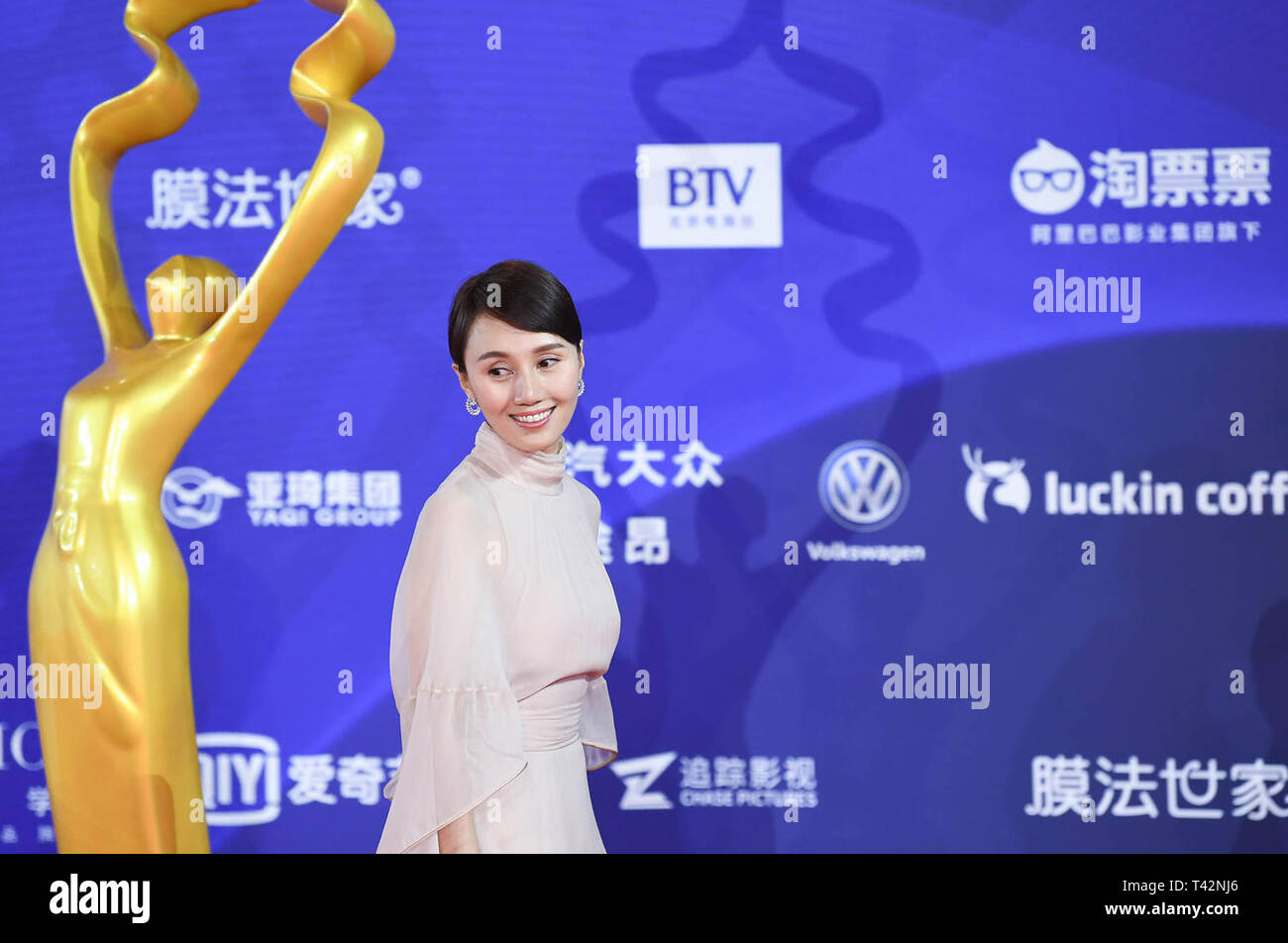 Beijing, China. 13th Apr, 2019. Actress Yuan Quan walks on the red carpet for the opening ceremony of the ninth Beijing International Film Festival in Beijing, capital of China, April 13, 2019. Credit: Jin Liangkuai/Xinhua/Alamy Live News Stock Photo