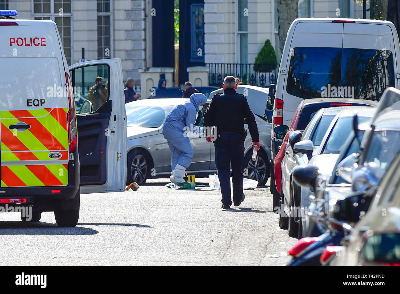 London, UK.  13 April 2019.  The scene in Holland Park Avenue, west London, where it is reported police opened fire on a vehicle outside the Ukrainian embassy after the car repeatedly rammed into the official car of the country's UK ambassador.  A man in his 40s has been arrested.  No injuries have occured and police have said that the incident is not terror-related.  Credit: Stephen Chung / Alamy Live News Stock Photo