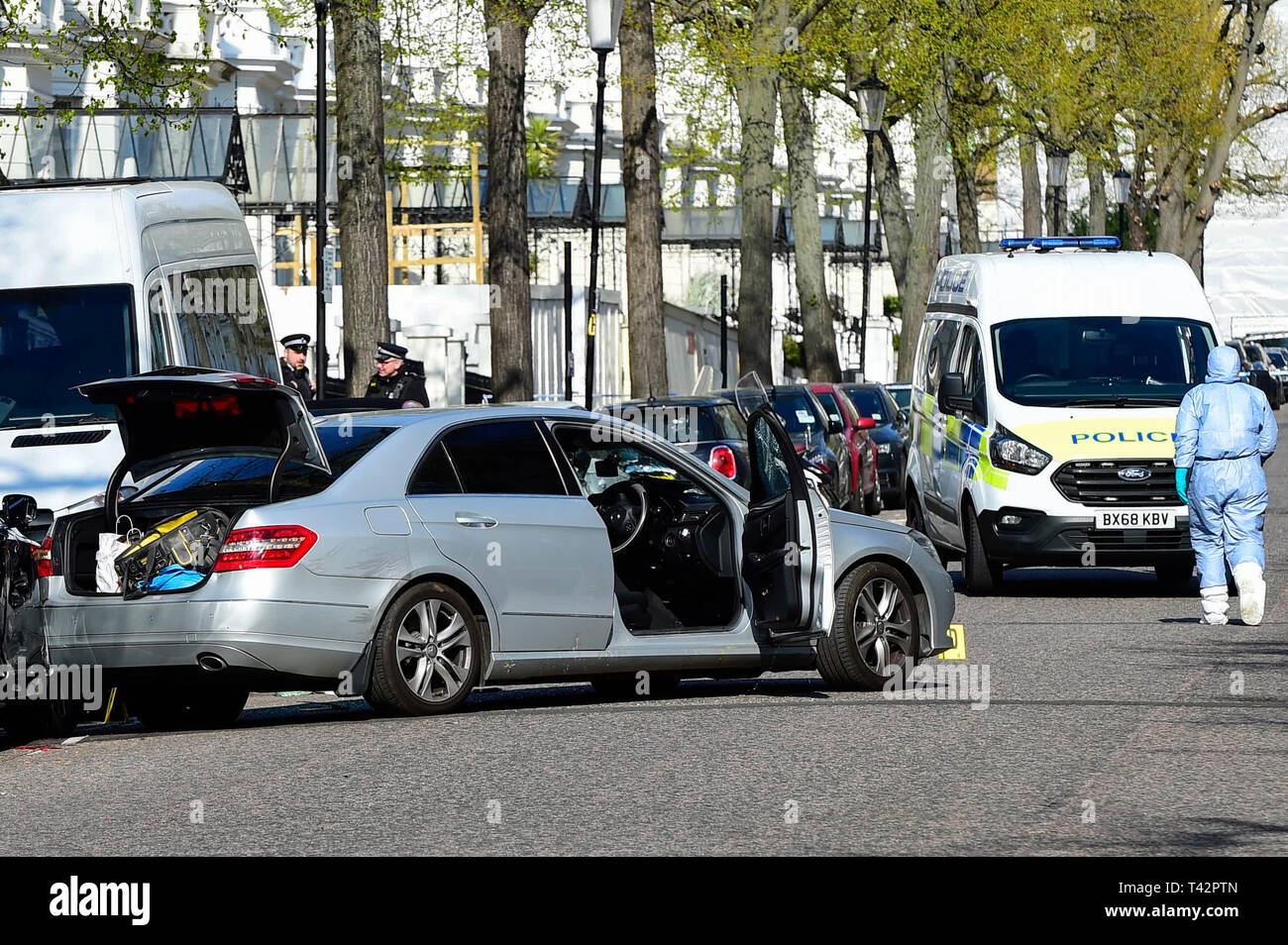 London, UK.  13 April 2019.  The scene in Holland Park Avenue, west London, where it is reported police opened fire on a vehicle outside the Ukrainian embassy after the car repeatedly rammed into the official car of the country's UK ambassador.  A man in his 40s has been arrested.  No injuries have occured and police have said that the incident is not terror-related.  Credit: Stephen Chung / Alamy Live News Stock Photo