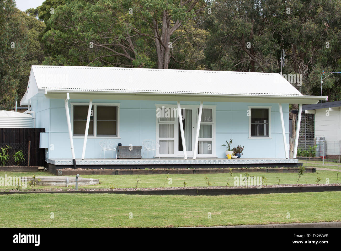 A post war weatherboard timber and steel corrugated iron roofed holiday cottage in Kioloa on the New South Wales south coast of Australia Stock Photo