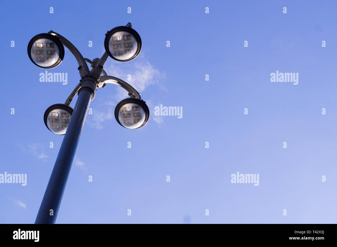 modern street lantern on the sky background. city life, lighting. Stock Photo