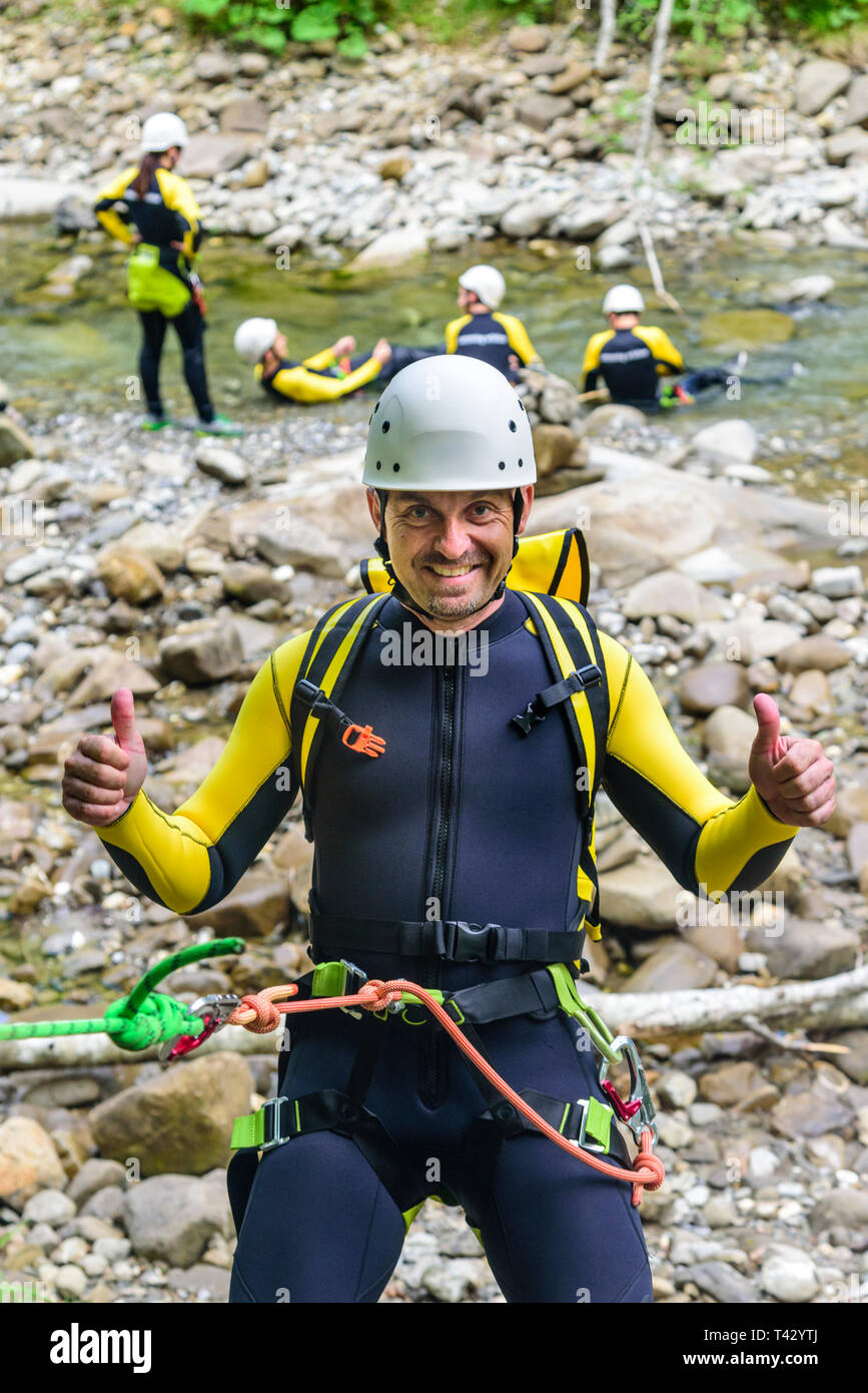 Canyoning - man has fun during abseiling training Stock Photo