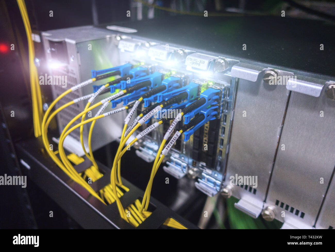 Optical switch and colorfull FC cables connected. Datacenter. Close up