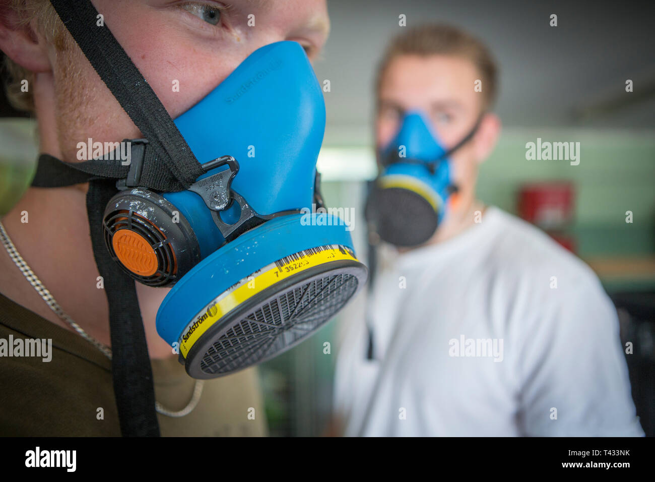 Graffiti painter with protective mask, Upplands Väsby, Sweden. Stock Photo