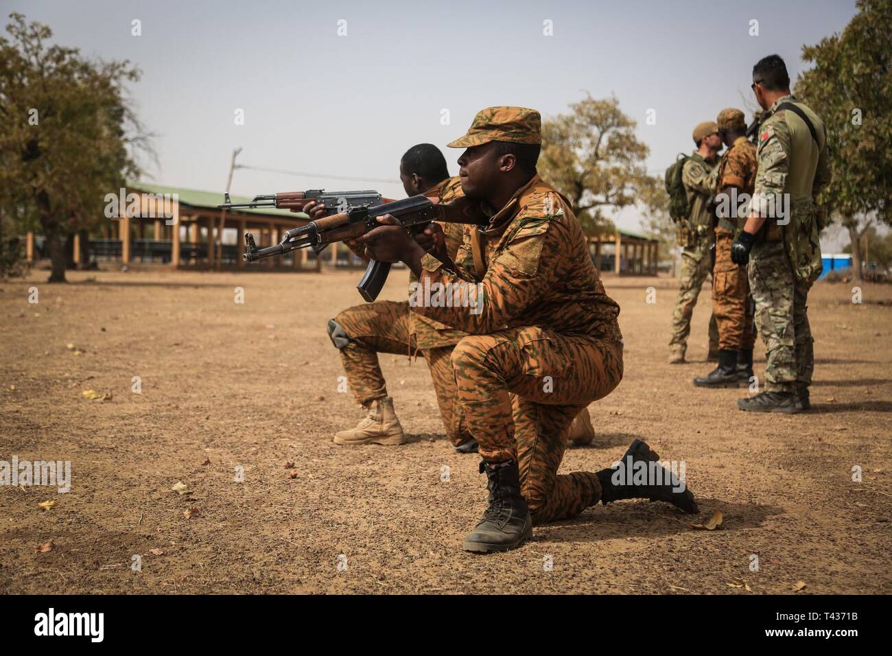Portuguese Special Forces soldiers train Burkina Faso soldiers on basic battle movements in base camp Loumbila, in Burkina Faso on Feb. 21, 2019. The training event is part of exercise Flintlock 19, where many Western and African partners are participating in multinational training events. Stock Photo