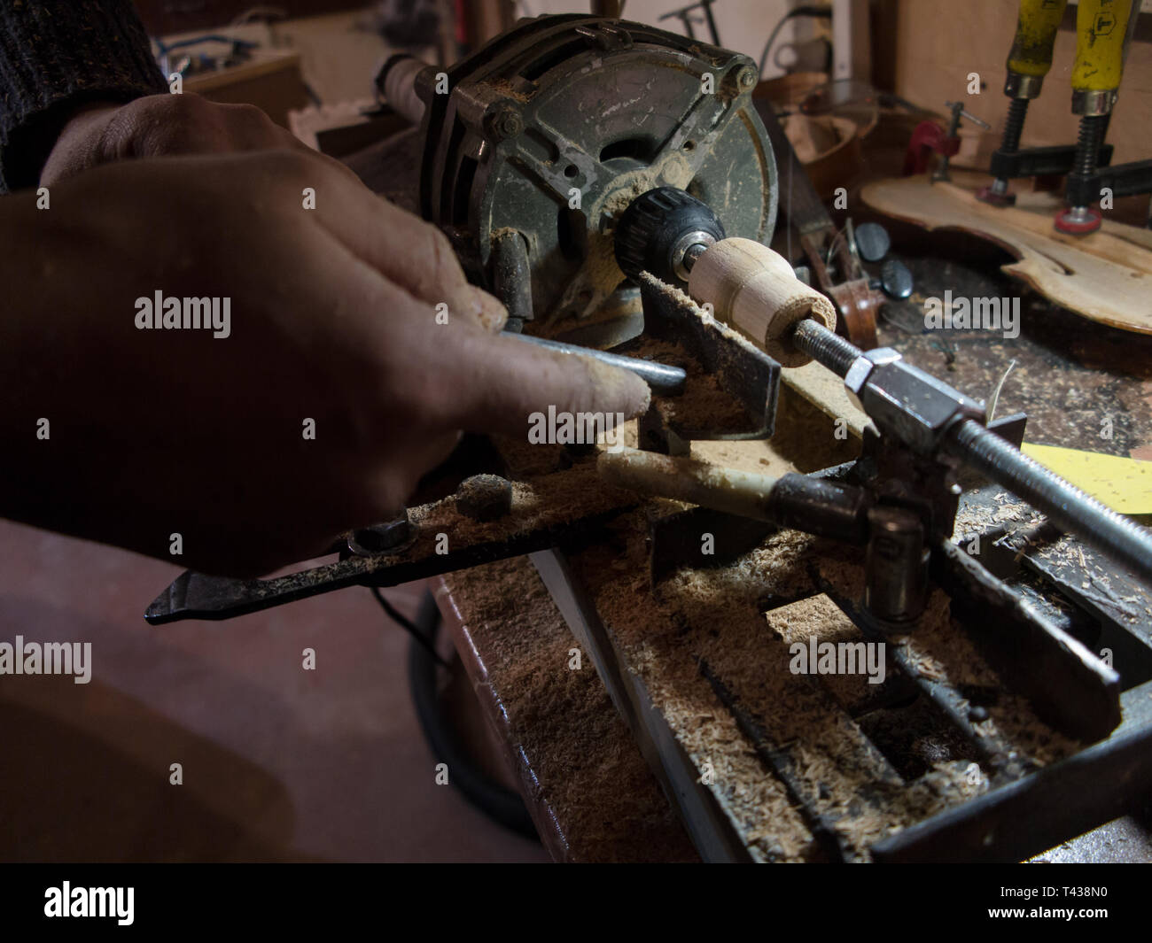 Carpenter working on self made wood lathe with chisel Stock Photo Alamy