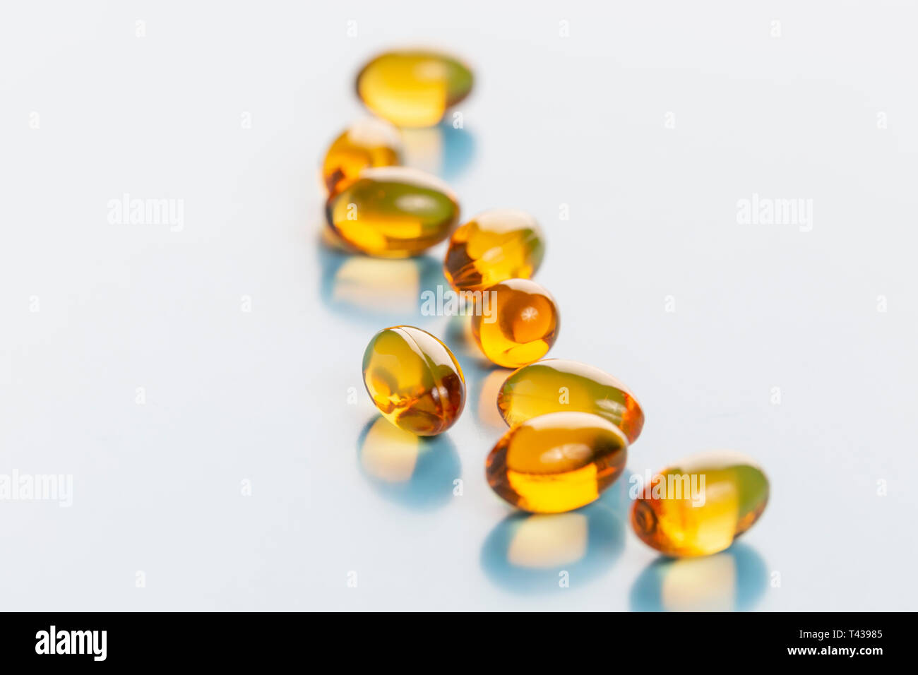 Capsules vitamin d3 fish oil on brigth background Stock Photo Alamy