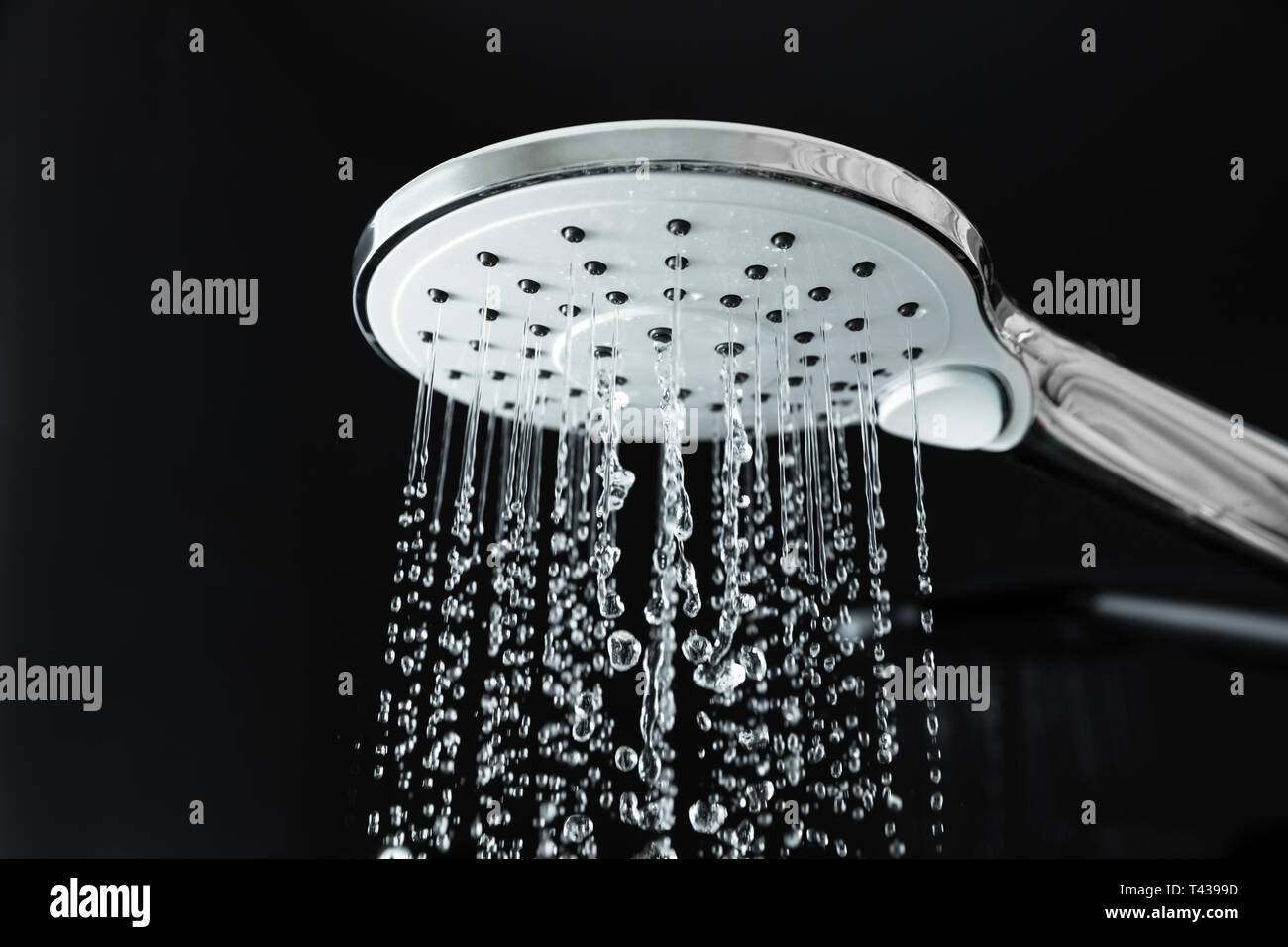 Close up shower head with water flowing flow hires stock photography