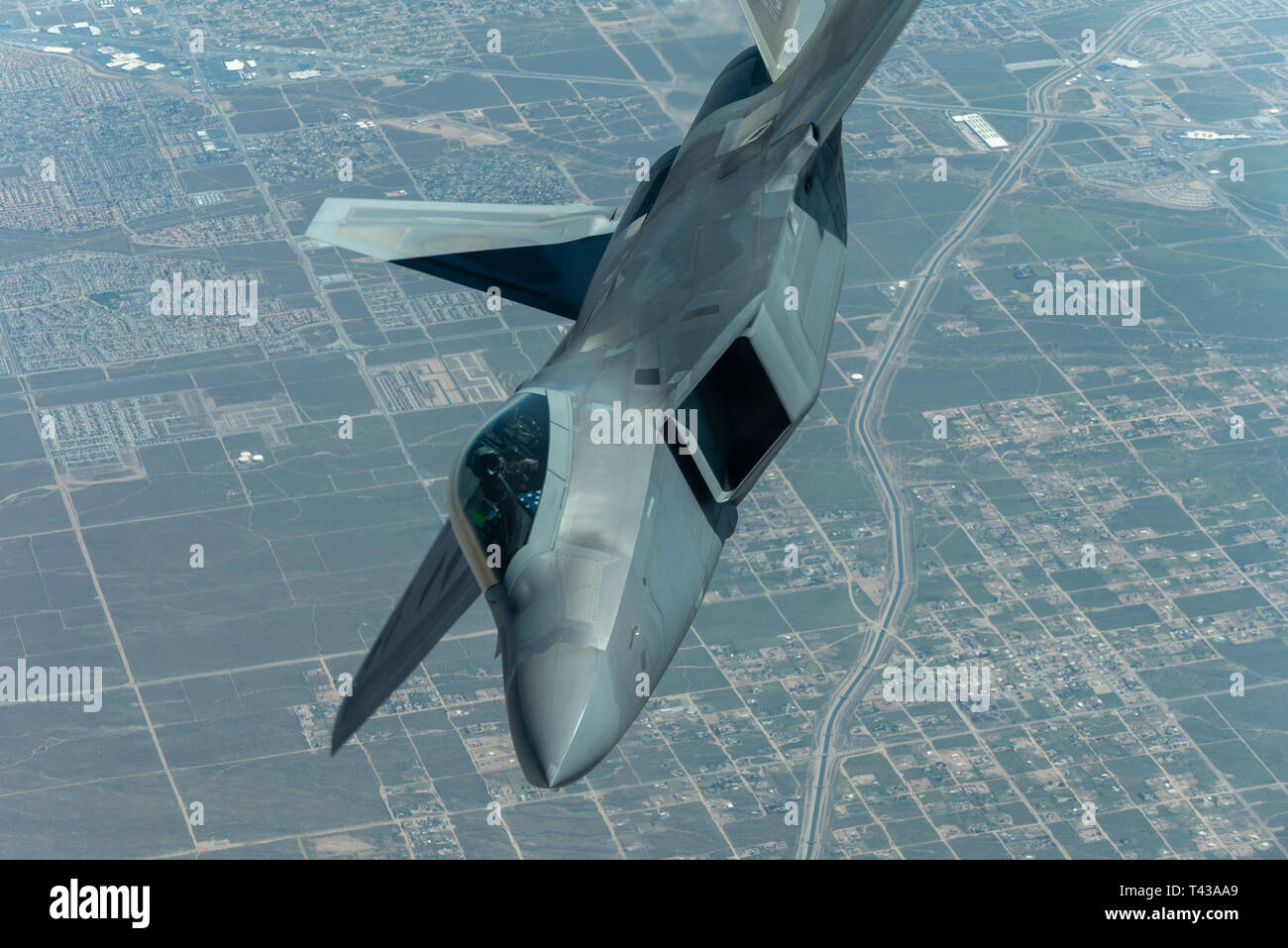 U.S. Air Force Maj. Paul 'Loco' Lopez, F-22 Demo Team pilot/commander, flies over the skies of Northern California while en route to Travis Air Force Base for the Thunder Over the Bay air show March 25, 2019. Maj. Lopez received fuel along the way from a KC-10 Extender attached to the 9th Air Refueling Squadron out of Travis AFB. (U.S. Air Force photo by 2nd Lt. Samuel Eckholm) Stock Photo