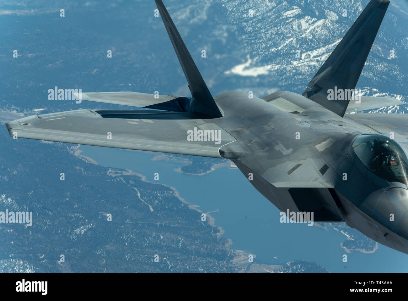 U.S. Air Force 1st Lt. Cory Clark, F-22 Demo Team safety observer, positions the Raptor for aerial refueling while en route to Travis Air Force Base for the Thunder Over the Bay air show March 25, 2019. 1st Lt. Clark received fuel along the way from a KC-10 Extender attached to the 9th Air Refueling Squadron out of Travis AFB. (U.S. Air Force photo by 2nd Lt. Samuel Eckholm) Stock Photo
