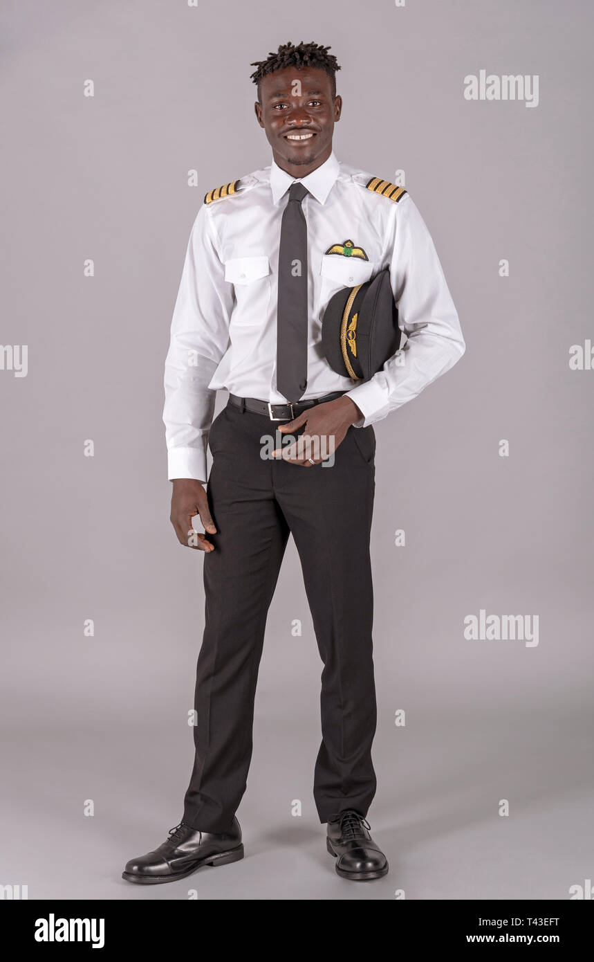 April 2019.  A young airline pilot with an african dred hairstyle. Stock Photo