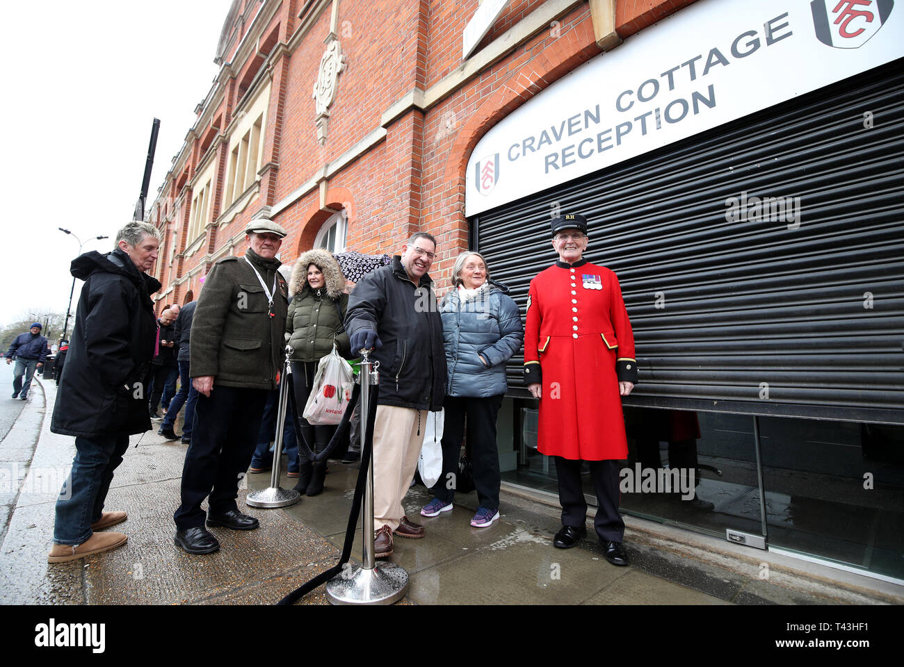 Chelsea pensioner Walter Swan heads the queue of people at reception before the Premier League match at Craven Cottage, London. Stock Photo