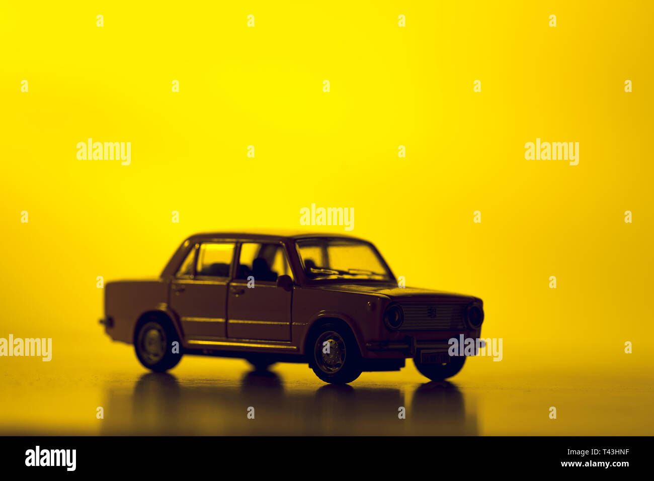 Izmir, Turkey - December 15, 2018: Silhouette toy car on a vibrant red background. Stock Photo