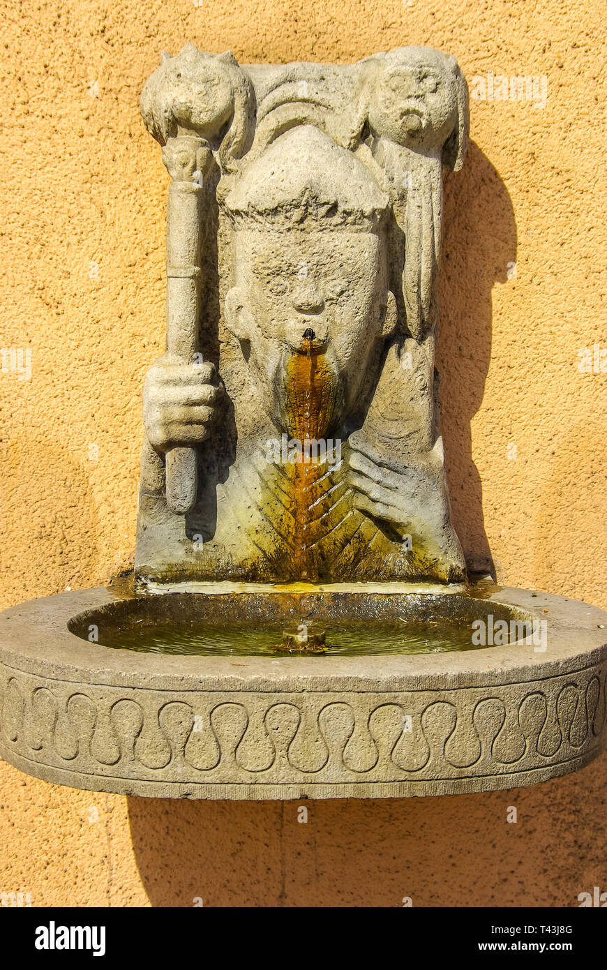 Historic drinking water fountain attached to an old house facade on Konzil Street in Konstanz at Lake Constance, Baden-Wurttemberg, Germany, Europe. Stock Photo