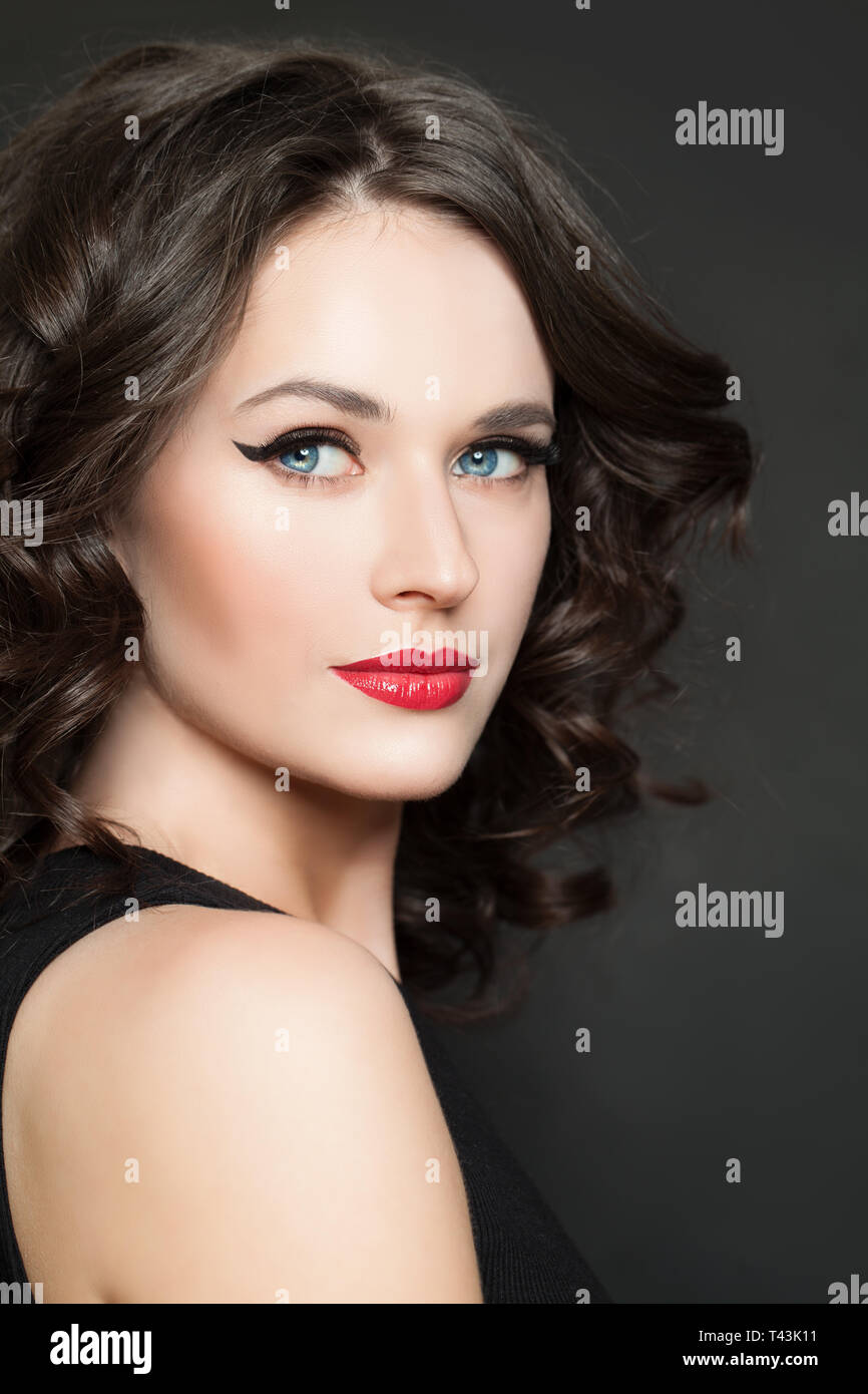 Cheerful model woman with makeup and curly hair portrait Stock Photo