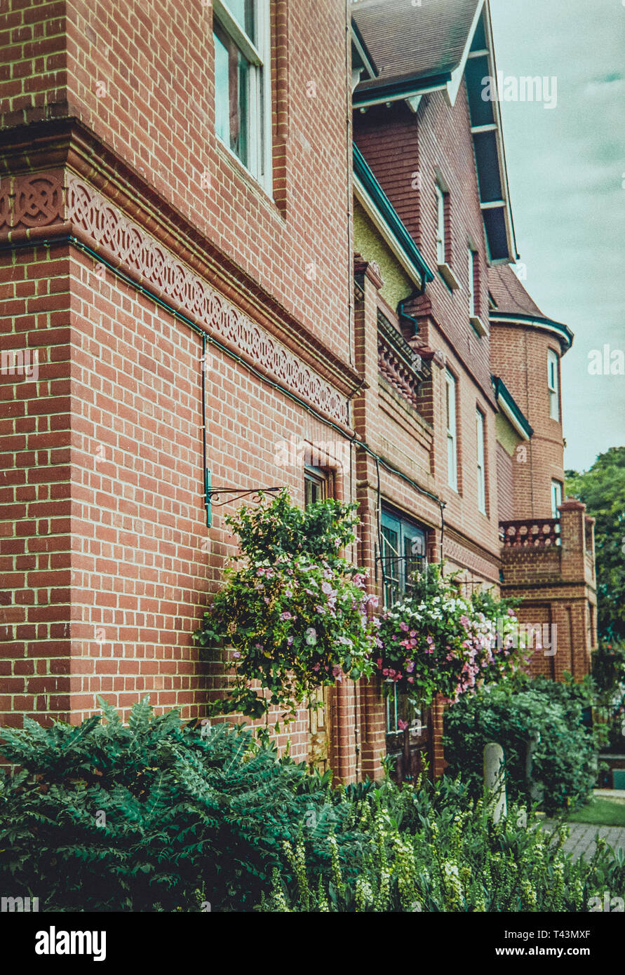 Red brick facade of an old English mansion Stock Photo