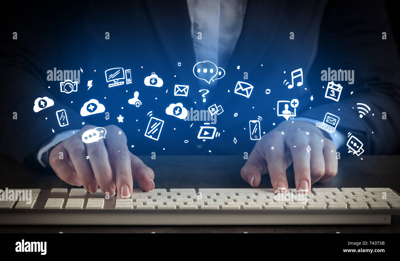 Blogger woman typing on keyboard with drawn application icons around ...
