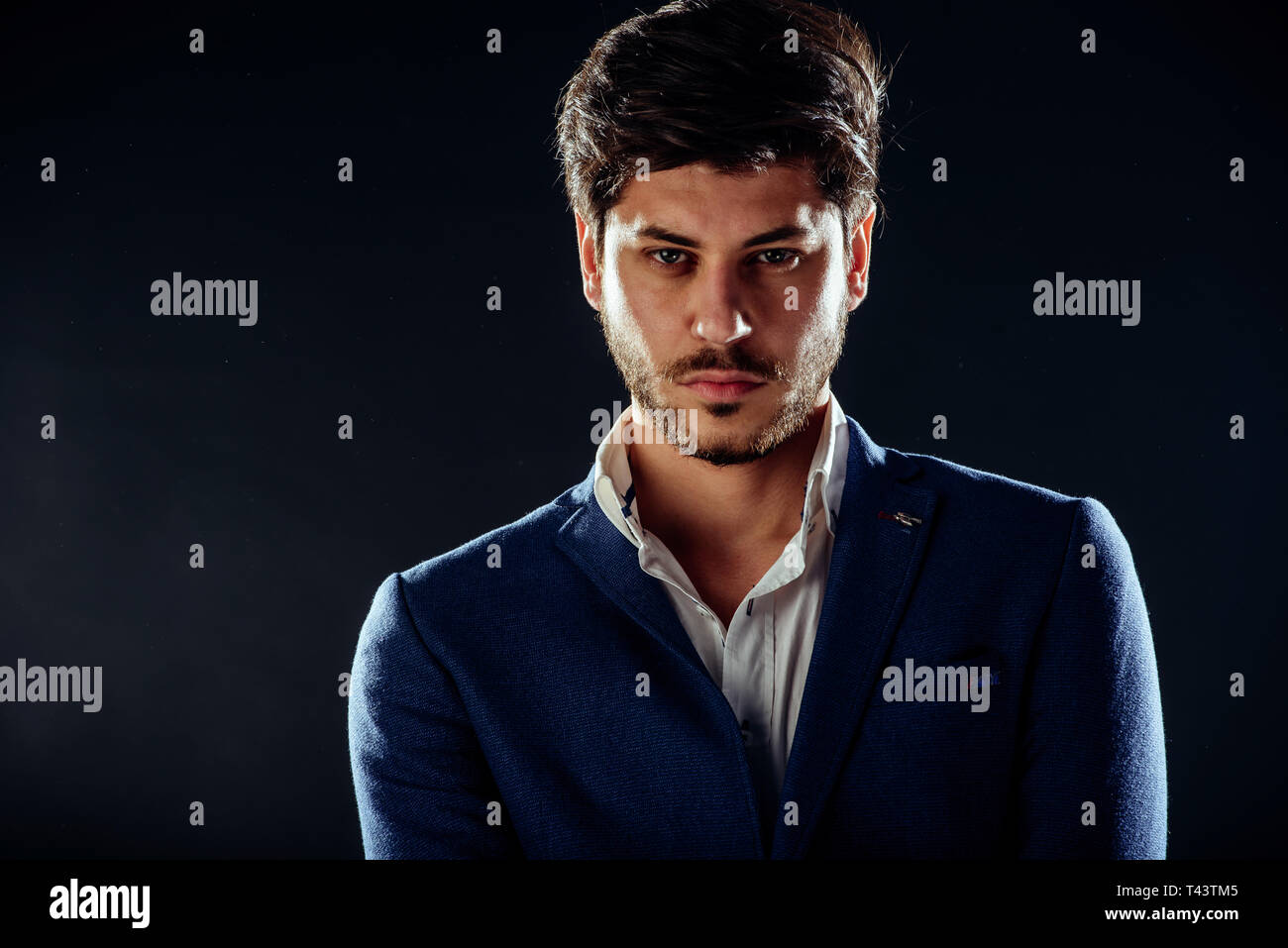 Portrait Of A Fashionable Young Man With Stylish Haircut Wearing