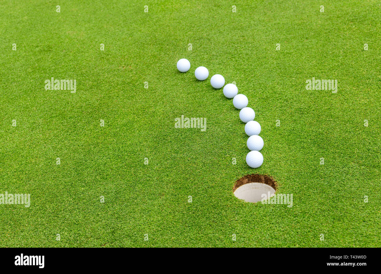 Primary goal of a golf game ball has to go into the hole Stock