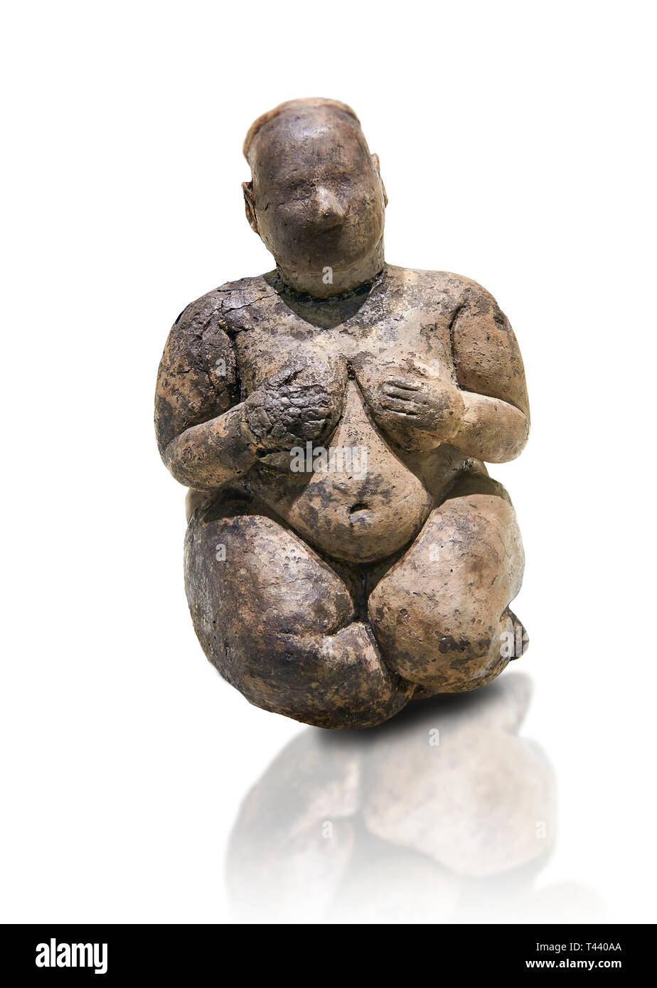 Seated terracotta goddess, probably a sign of fertility. Catalhoyuk Collections. Museum of Anatolian Civilisations, Ankara. Against a white background Stock Photo