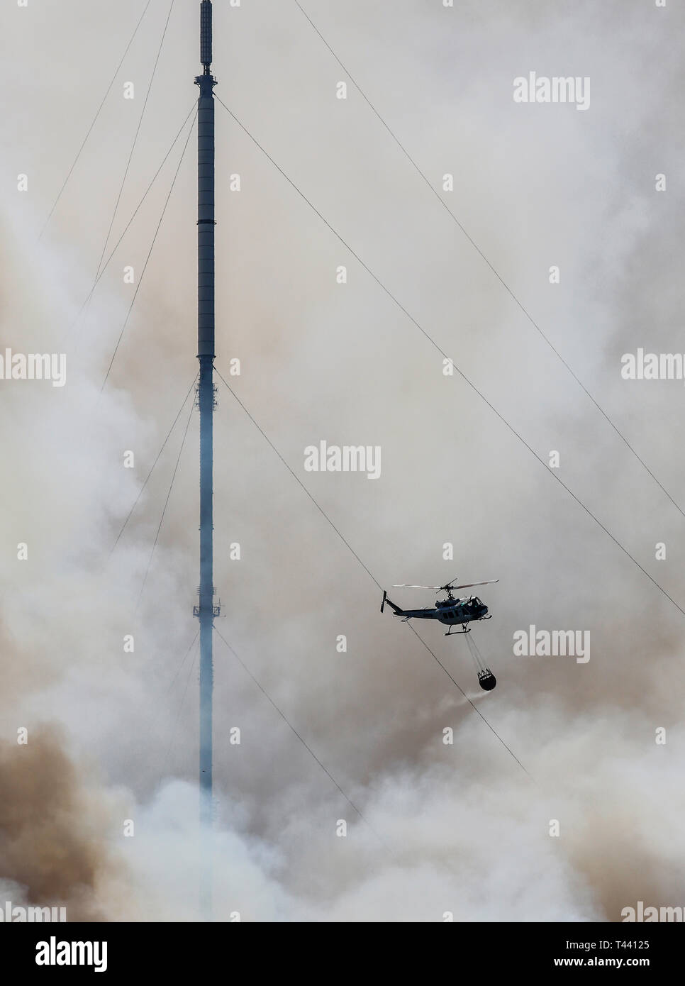Helicopter fighting fire on Winter Hill, summer 2018 Stock Photo