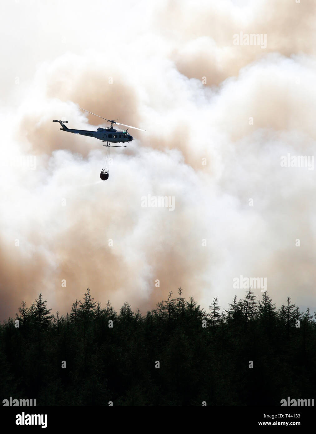 Helicopter fighting fire on Winter Hill, summer 2018 Stock Photo